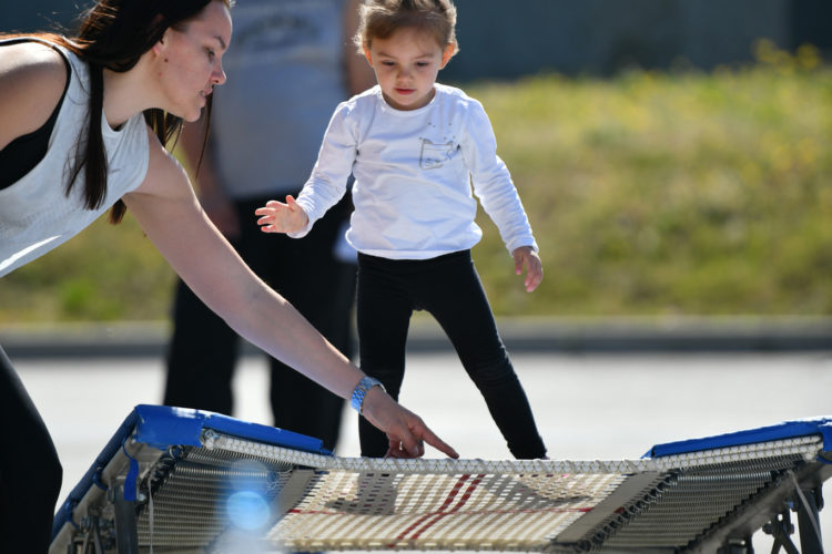 Kid learning to jump on a trampoline